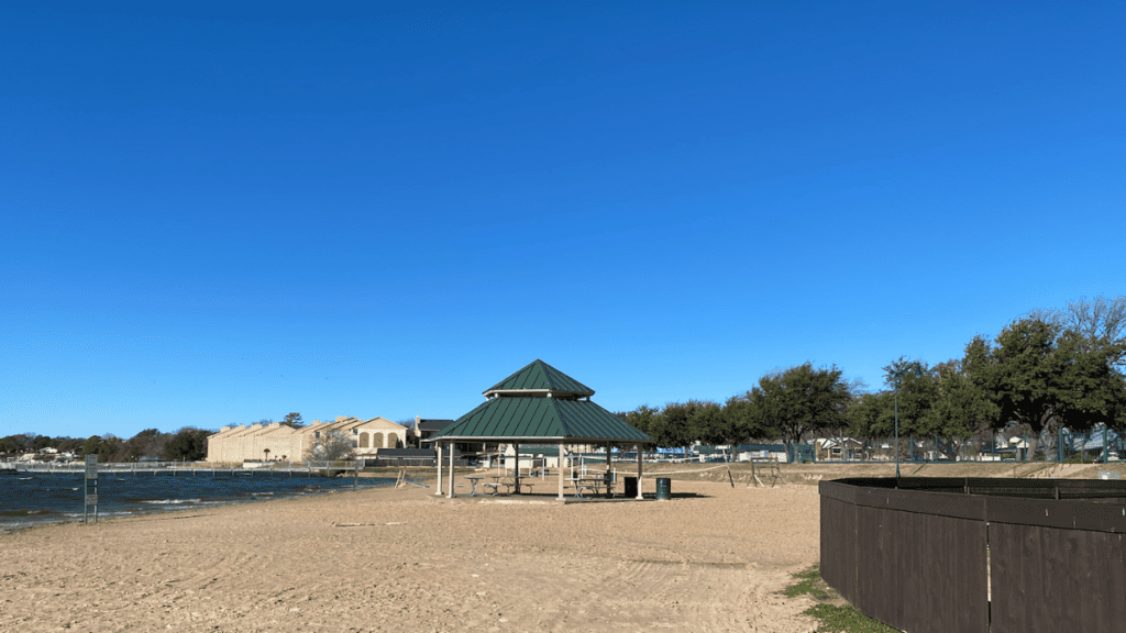 a photo of granbury city beach park with views of water and pavillion