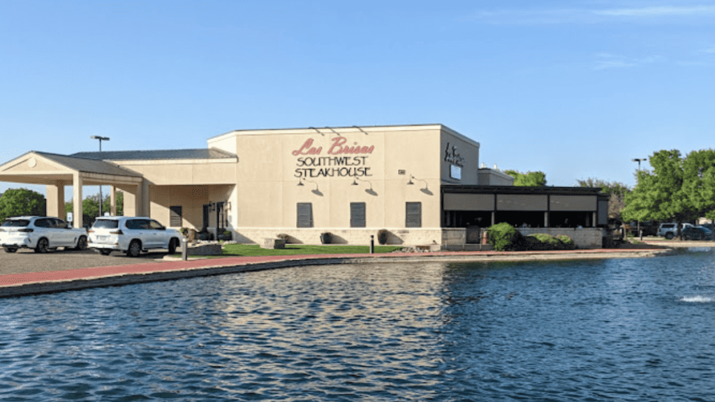 "An image capturing the vibrant atmosphere of Las Brisas, Lubbock's premier Southwestern fine dining steakhouse. The photo showcases a blend of modern elegance and rustic charm, with ambient lighting and a welcoming ambiance, inviting guests to experience exquisite cuisine and top-notch service."